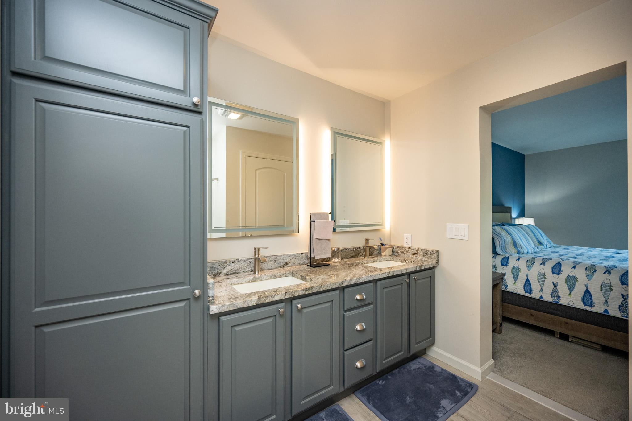 1488 Marsh Hill Road McHenry, MD 21541 - Photo 29 of 64 a bathroom with a granite countertop sink and a mirror
