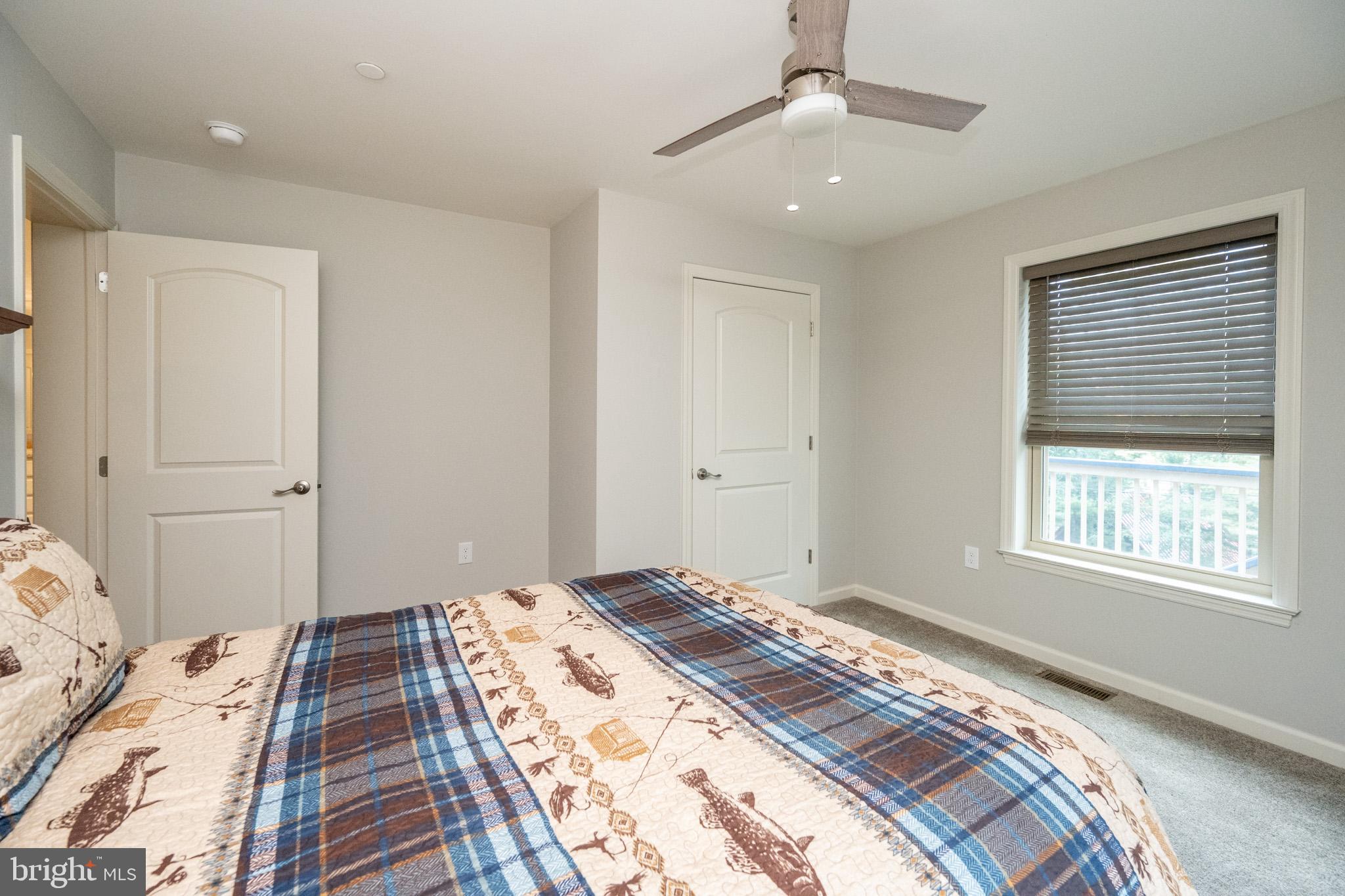 1488 Marsh Hill Road McHenry, MD 21541 - Photo 36 of 64 a bedroom with a bed and a window