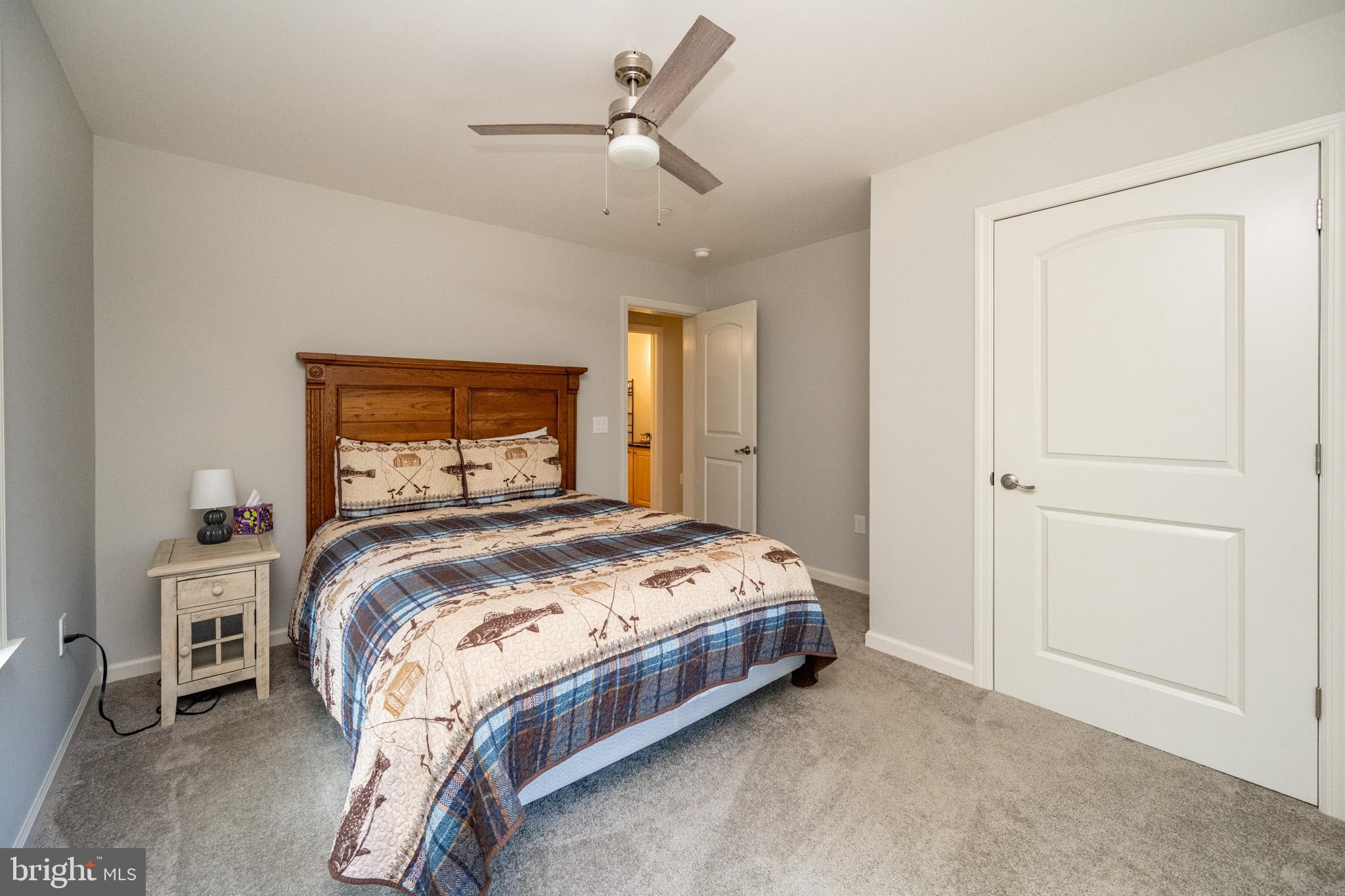 1488 Marsh Hill Road McHenry, MD 21541 - Photo 37 of 64 a bedroom with a bed and a chandelier