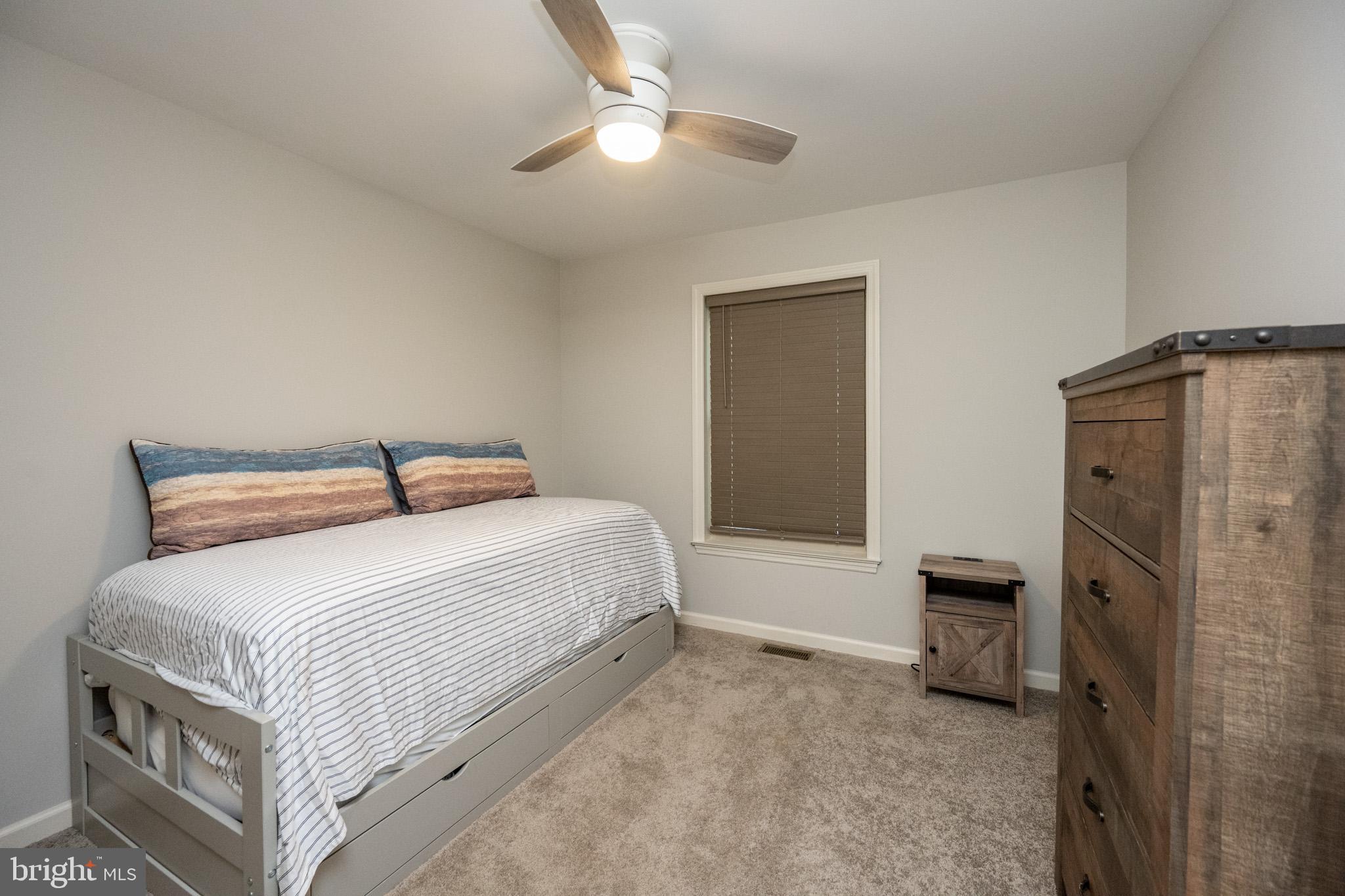 1488 Marsh Hill Road McHenry, MD 21541 - Photo 38 of 64 a bedroom with a bed and a refrigerator