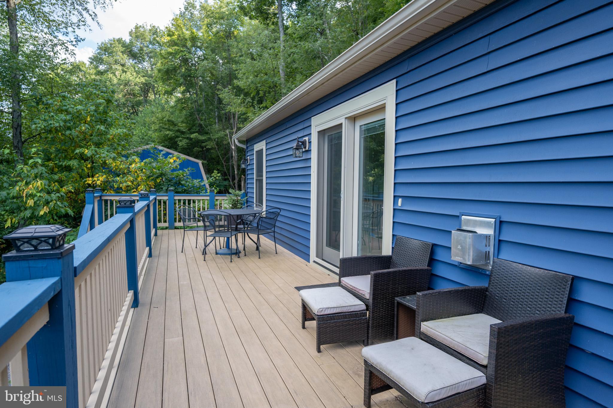 1488 Marsh Hill Road McHenry, MD 21541 - Photo 55 of 64 a balcony with furniture and wooden floor