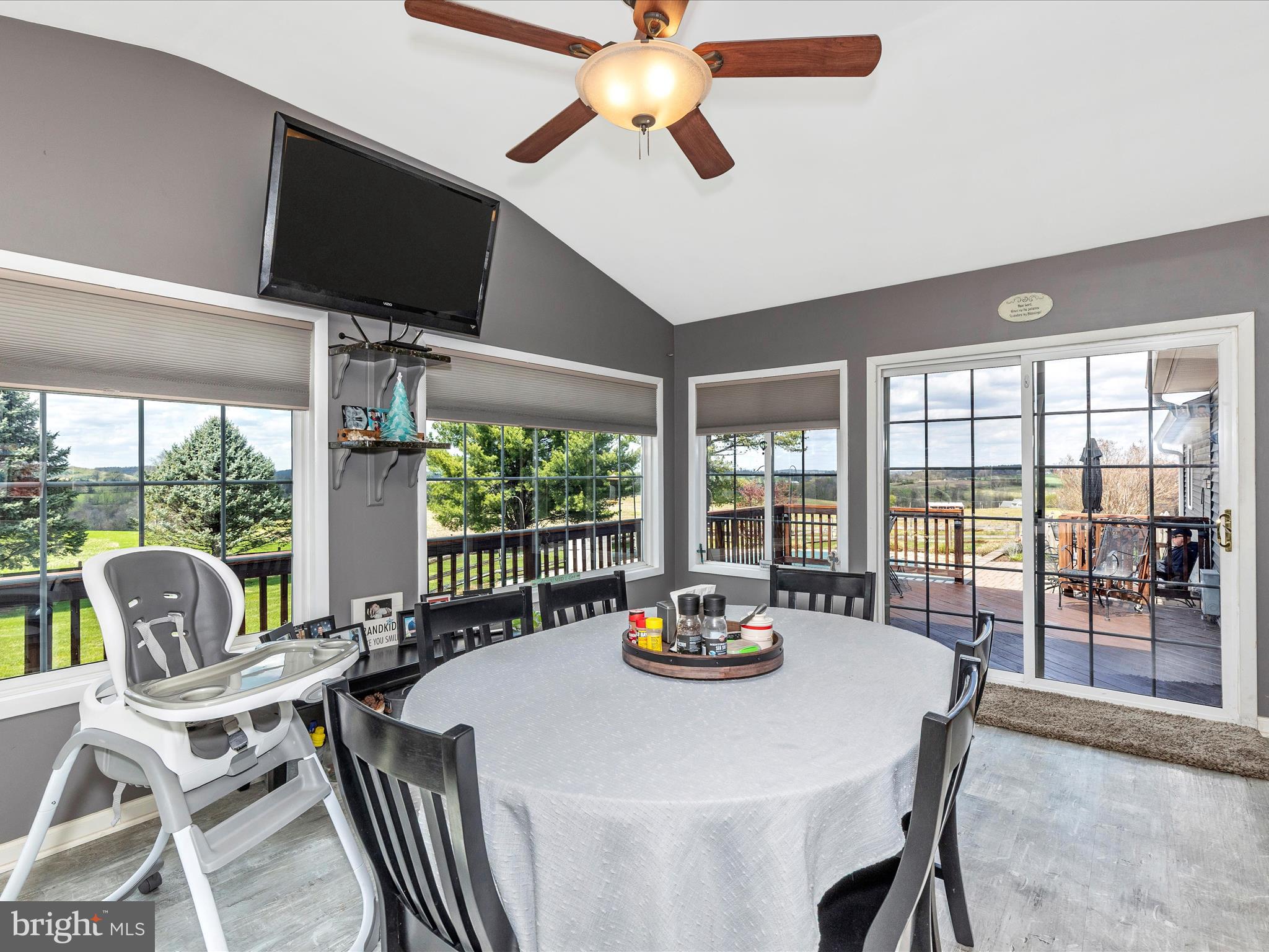 3101 Buffalo Road New Windsor, MD 21776 - Photo 15 of 53 a view of a dining room with furniture large windows and a chandelier