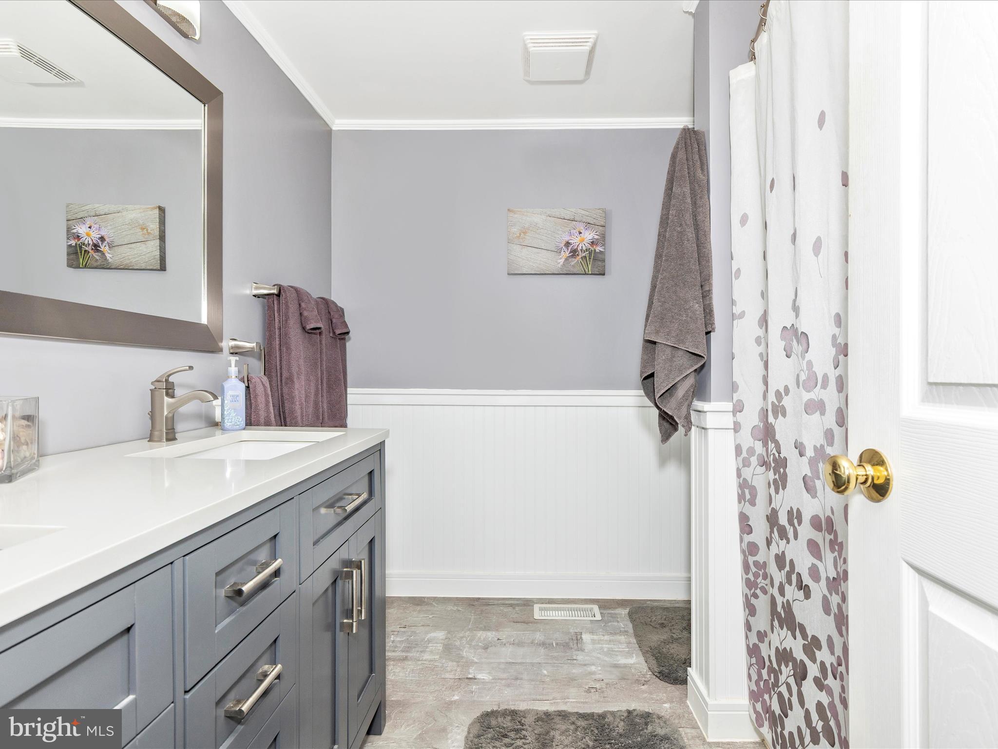 3101 Buffalo Road New Windsor, MD 21776 - Photo 24 of 53 a bathroom with a granite countertop shower sink and mirror