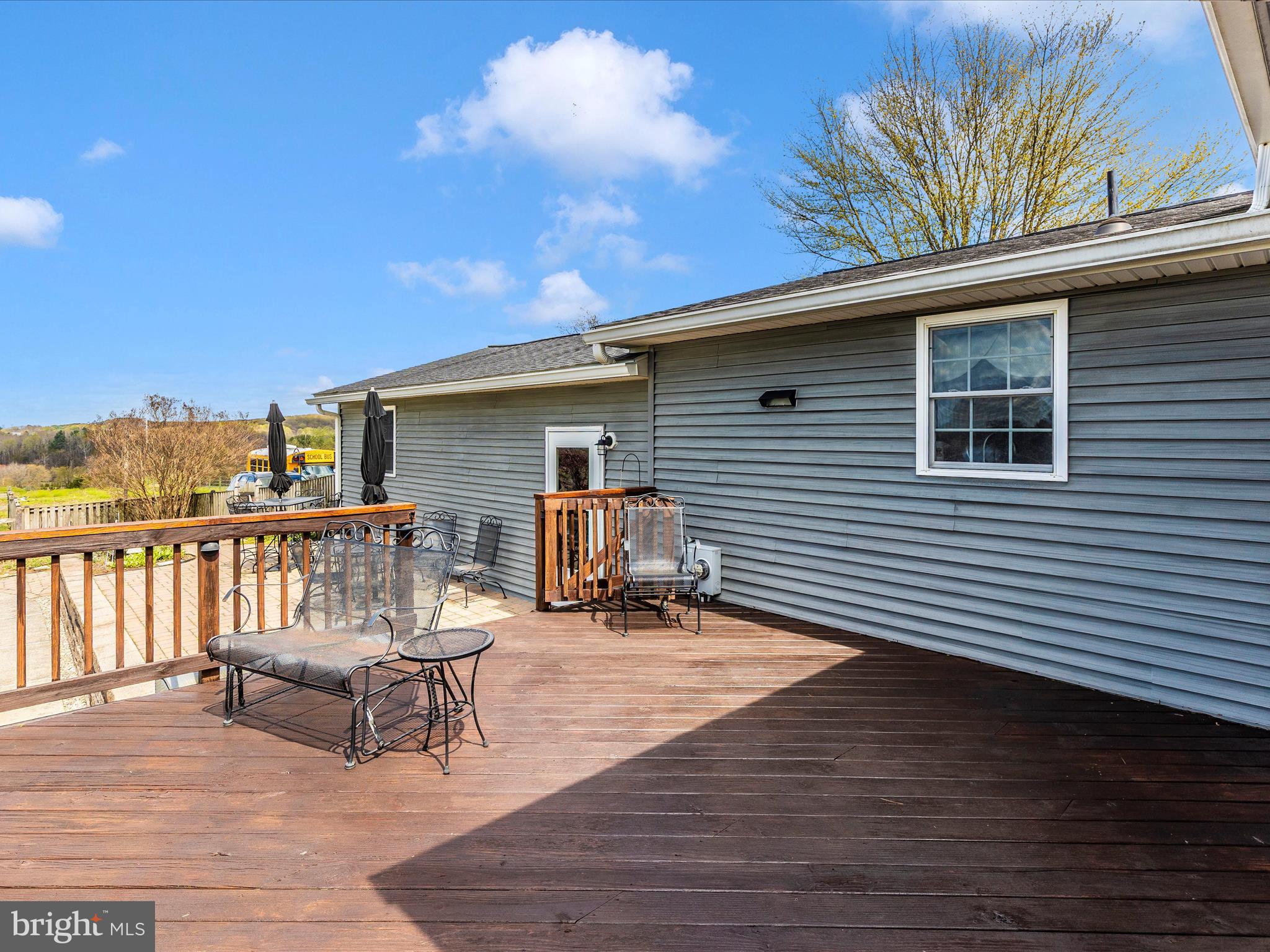 3101 Buffalo Road New Windsor, MD 21776 - Photo 36 of 53 a view of a deck with furniture and a floor to ceiling window