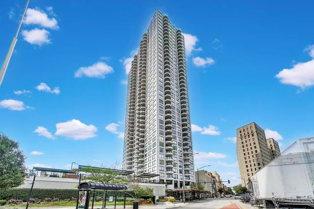 a view of a city with tall buildings