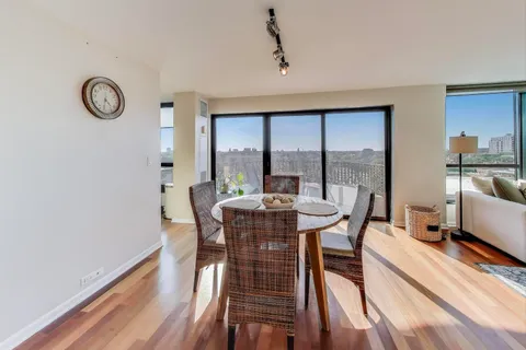a view of a dining room with furniture window and outside view