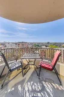 a view of a terrace with chairs
