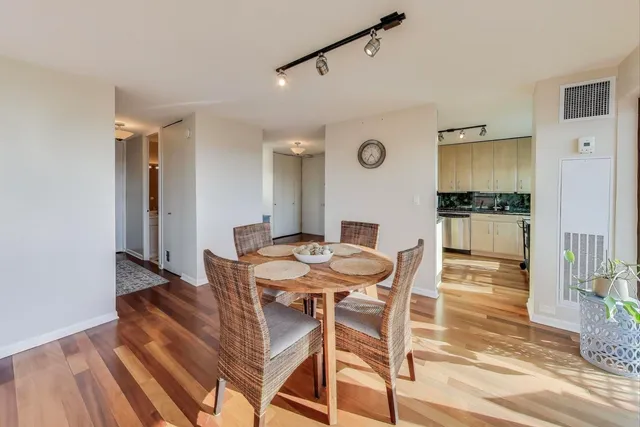 a kitchen with a refrigerator a stove a sink and a stove