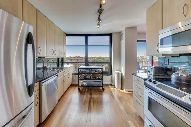 a kitchen with a stove and a refrigerator