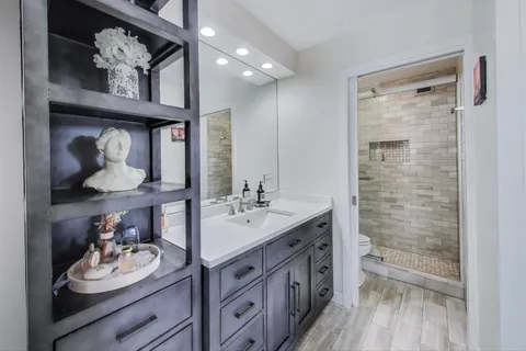 a bedroom with a bed and a cabinets