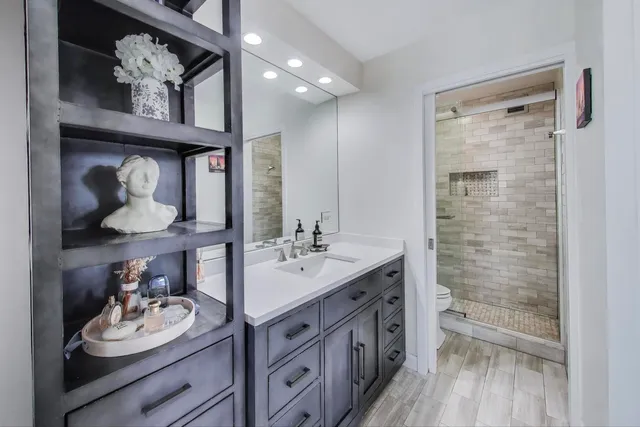 a bedroom with a bed and a cabinets