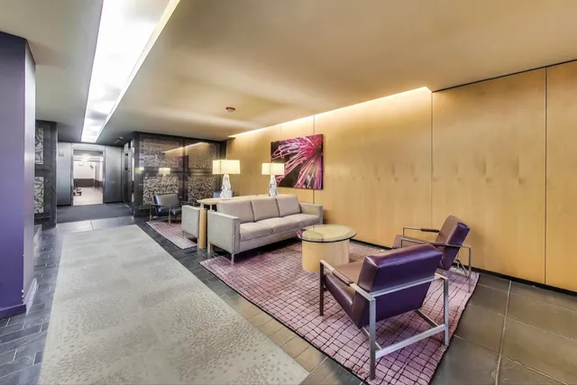 a living room with furniture and a rug