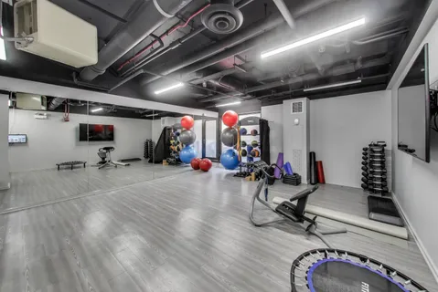 an aerial view of a house with a yard and lake view