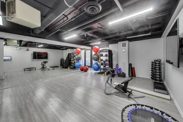 an aerial view of a house with a yard and lake view