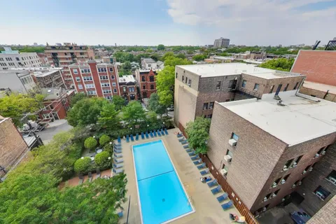 a view of a swimming pool with an outdoor space and seating area