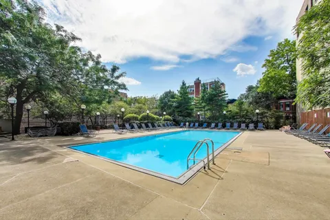 a patio with a yard table and chairs