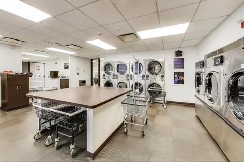 a view of a refrigerator and cabinets