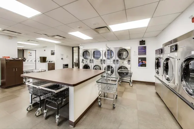 a view of a refrigerator and cabinets