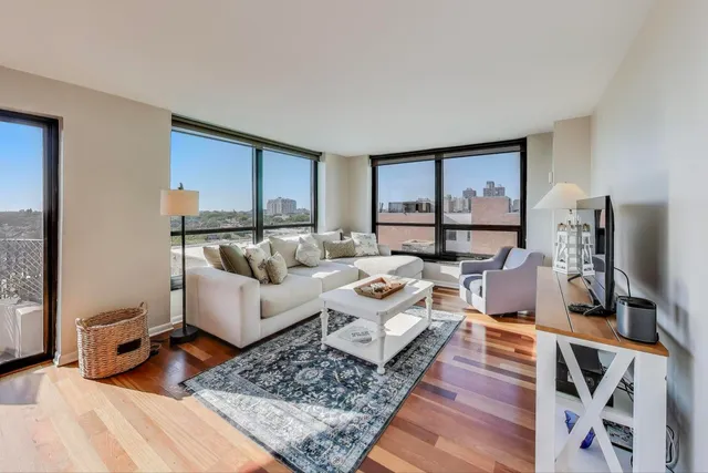 a living room with furniture and a rug