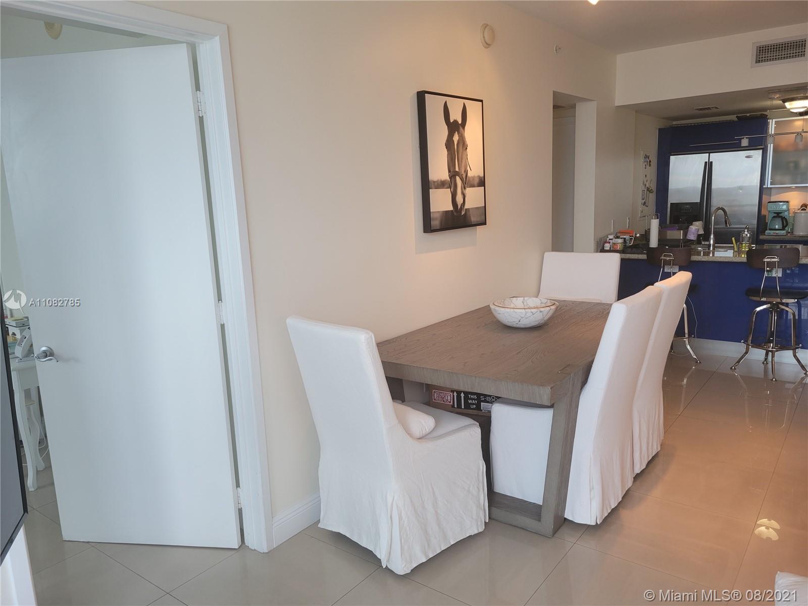 185 Southwest 7th Street, Unit 3502 Miami, FL 33130 - Photo 12 of 15 a view of a dining room with furniture