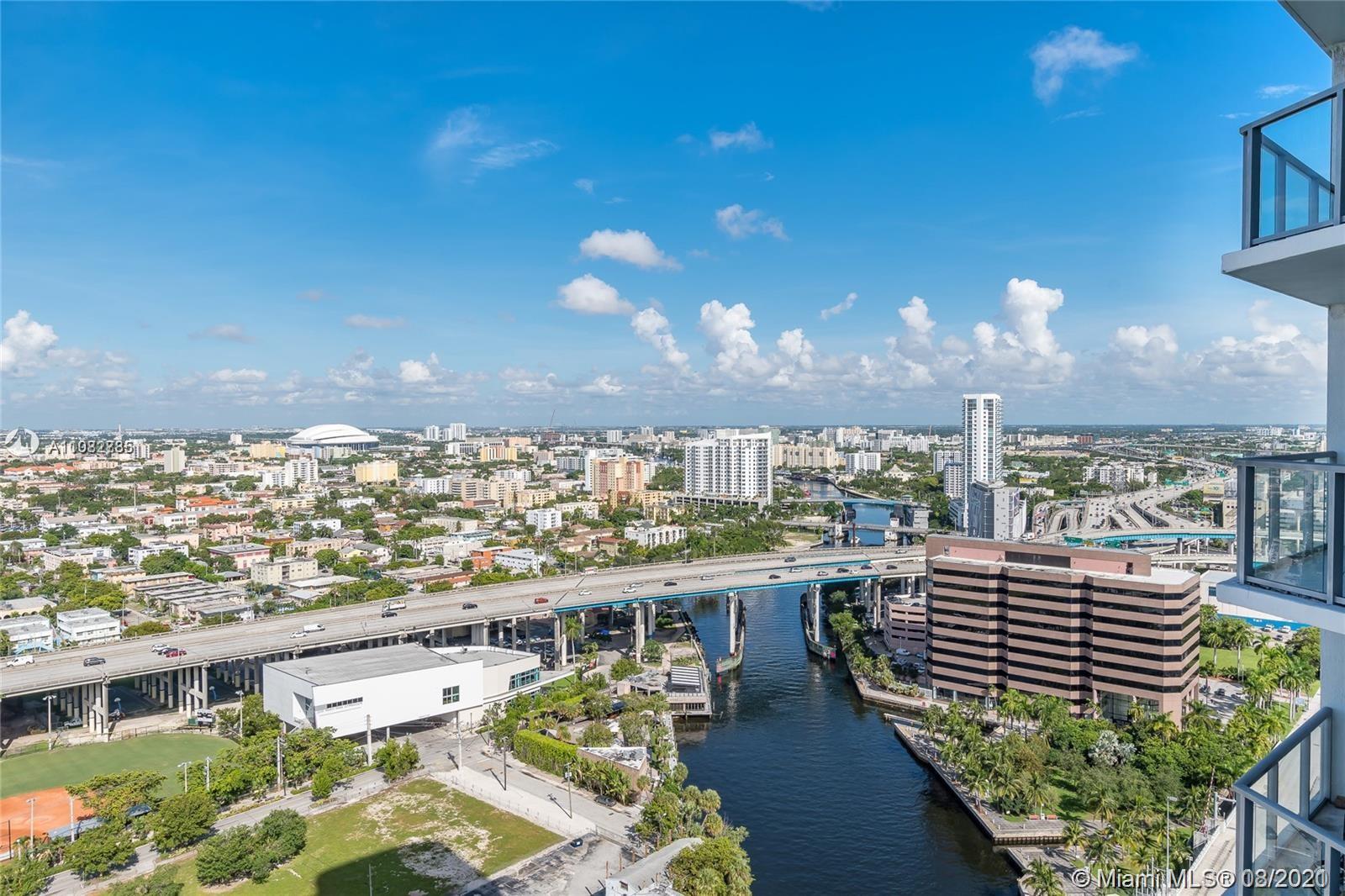 185 Southwest 7th Street, Unit 3502 Miami, FL 33130 - Photo 15 of 15 a view of a balcony with furniture