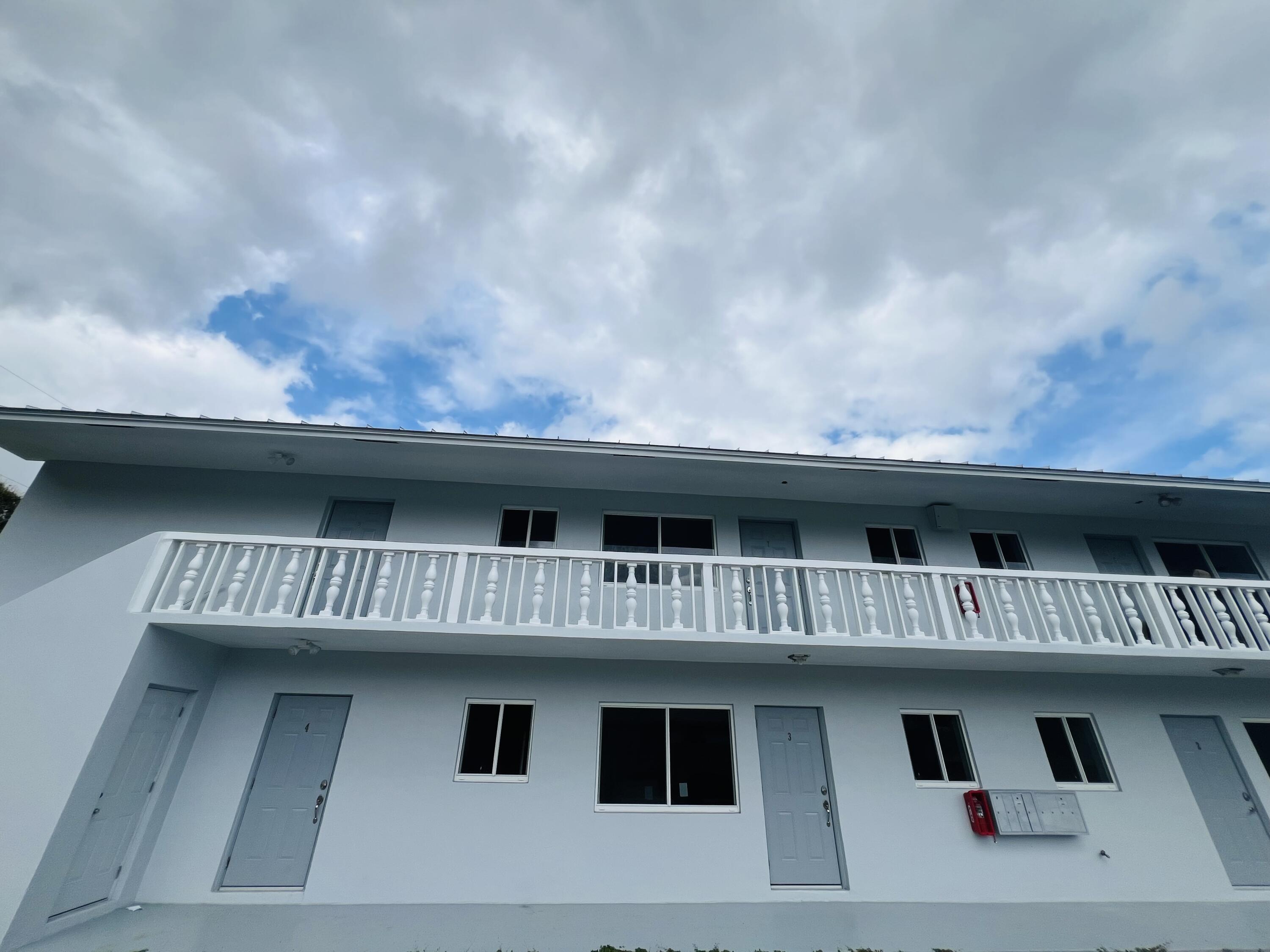 206 Southeast 1st Avenue, Unit 1 Delray Beach, FL 33444 - Photo 8 of 11 a view of a house with a balcony
