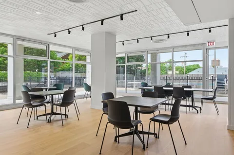 a view of a dining room with furniture window and outside view