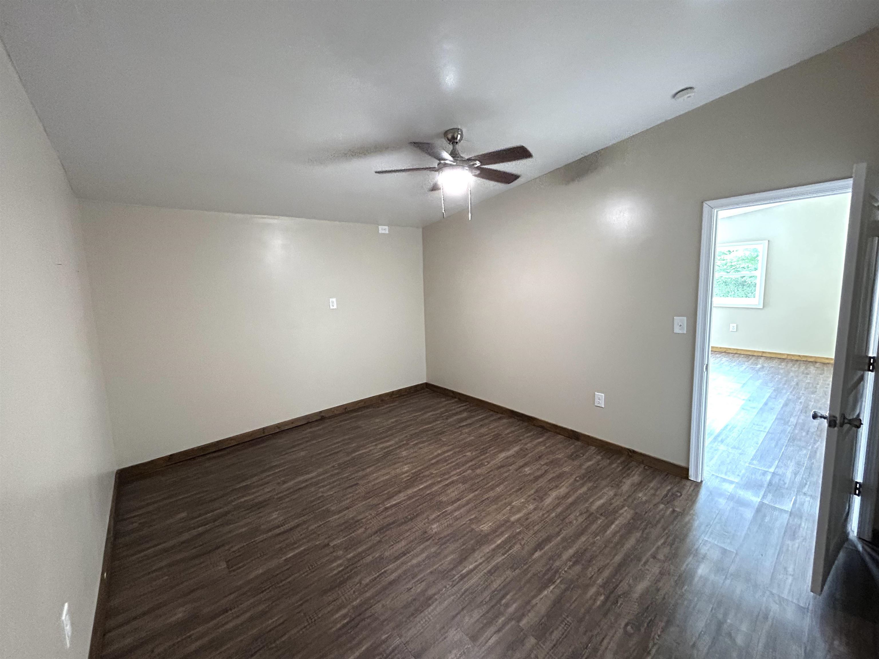 539 Oak Grove Church Road Waynesboro, VA 22980 - Photo 11 of 29 an empty room with wooden floor ceiling fan and window