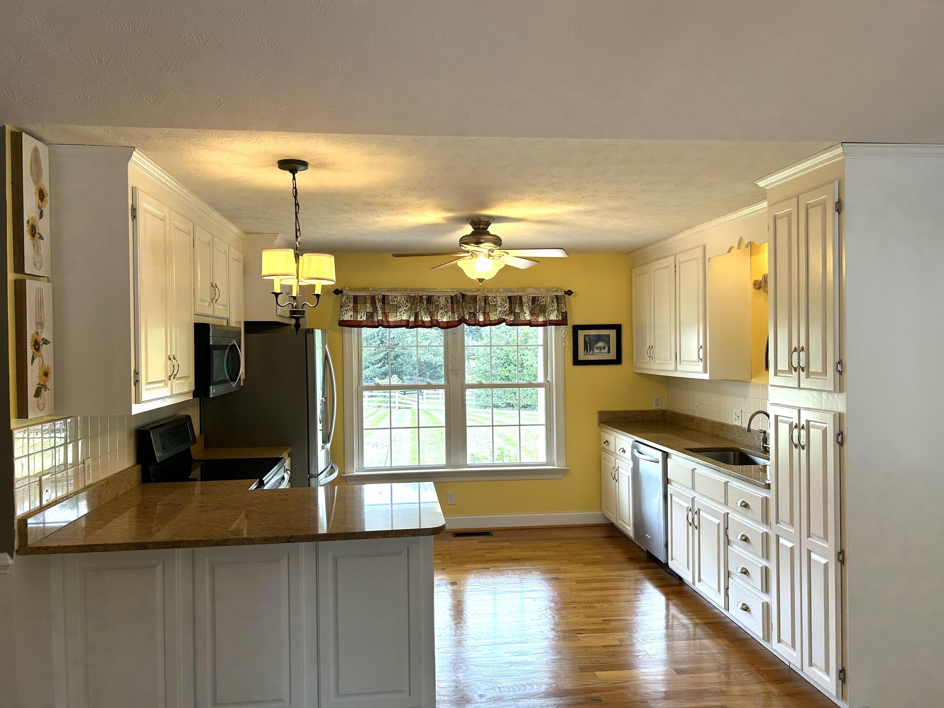 539 Oak Grove Church Road Waynesboro, VA 22980 - Photo 14 of 29 a view of a kitchen with a sink and wooden floor