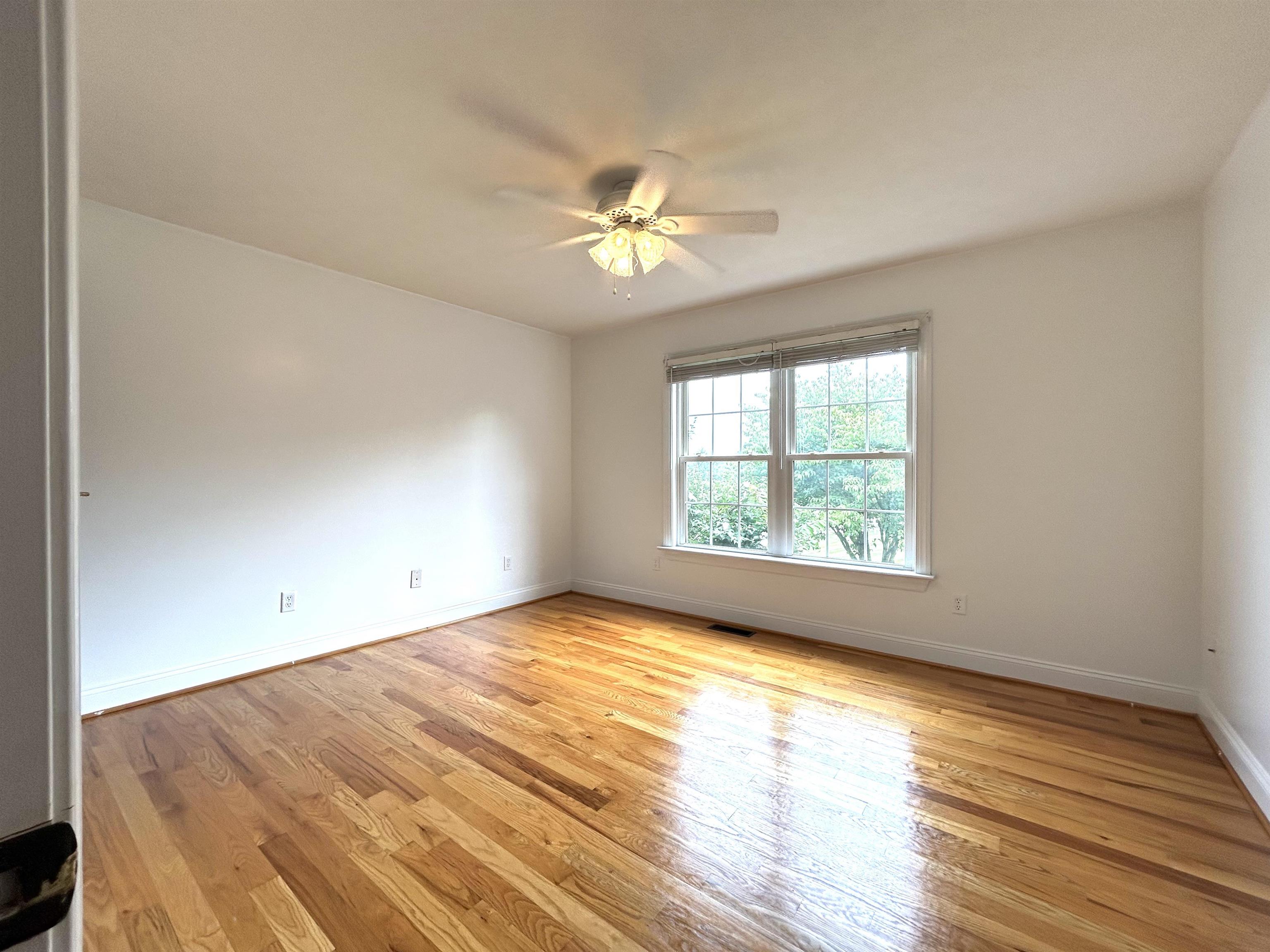 539 Oak Grove Church Road Waynesboro, VA 22980 - Photo 24 of 29 a view of empty room with wooden floor and fan