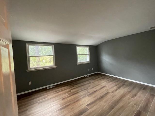 56 Wooded Court Calverton, NY 11933 - Photo 6 of 10 an empty room with windows