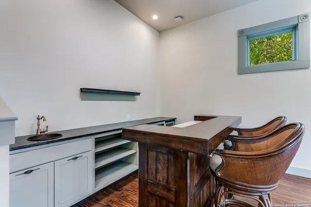 a room with chairs and table