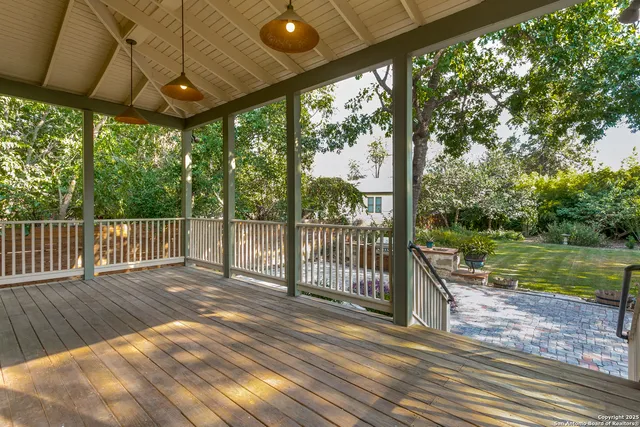 a view of a deck with a yard