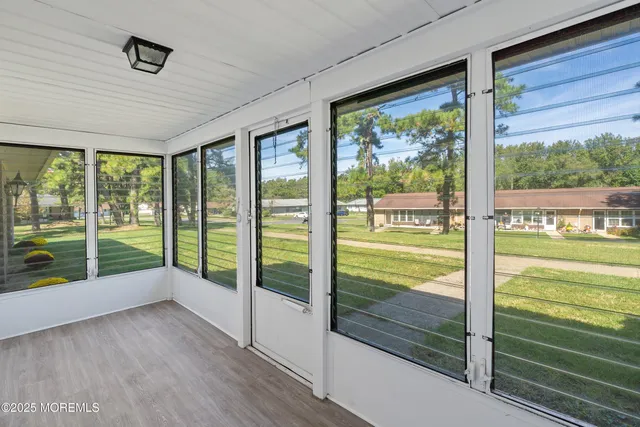 a spacious bedroom with a bed and a window
