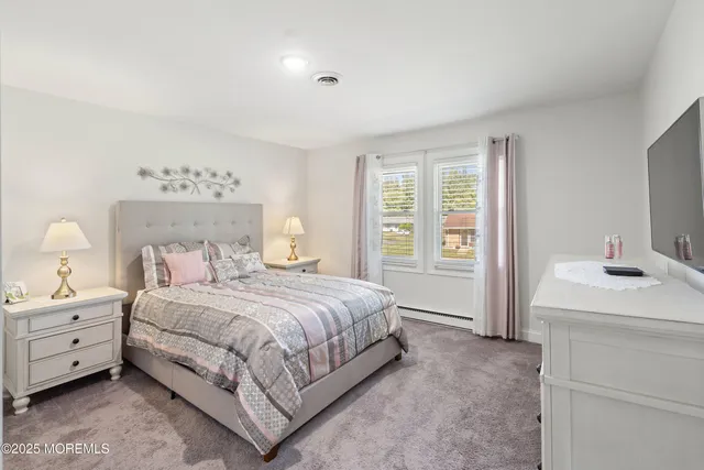 a bedroom with a bed and a table in it