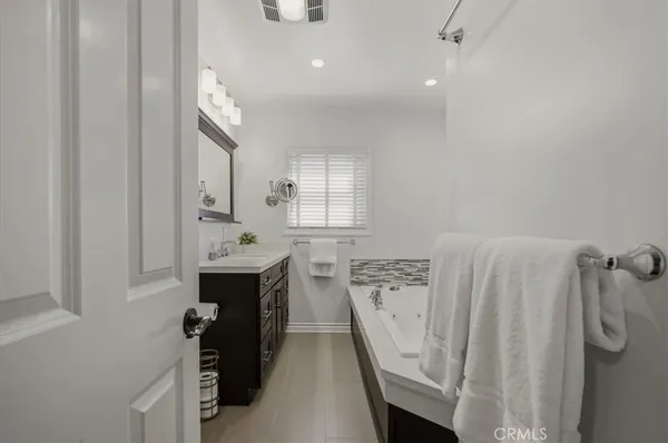 a bathroom with a shower sink and toilet