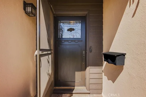 a view of an entryway with wooden floor