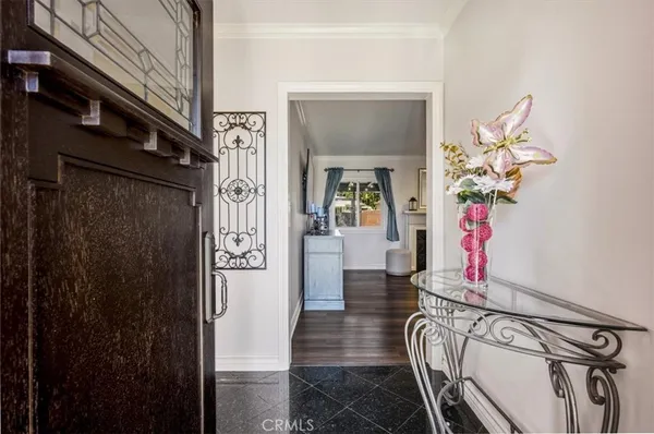 a living room with furniture fireplace and window