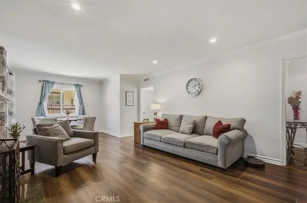 a living room with furniture fireplace and flat screen tv