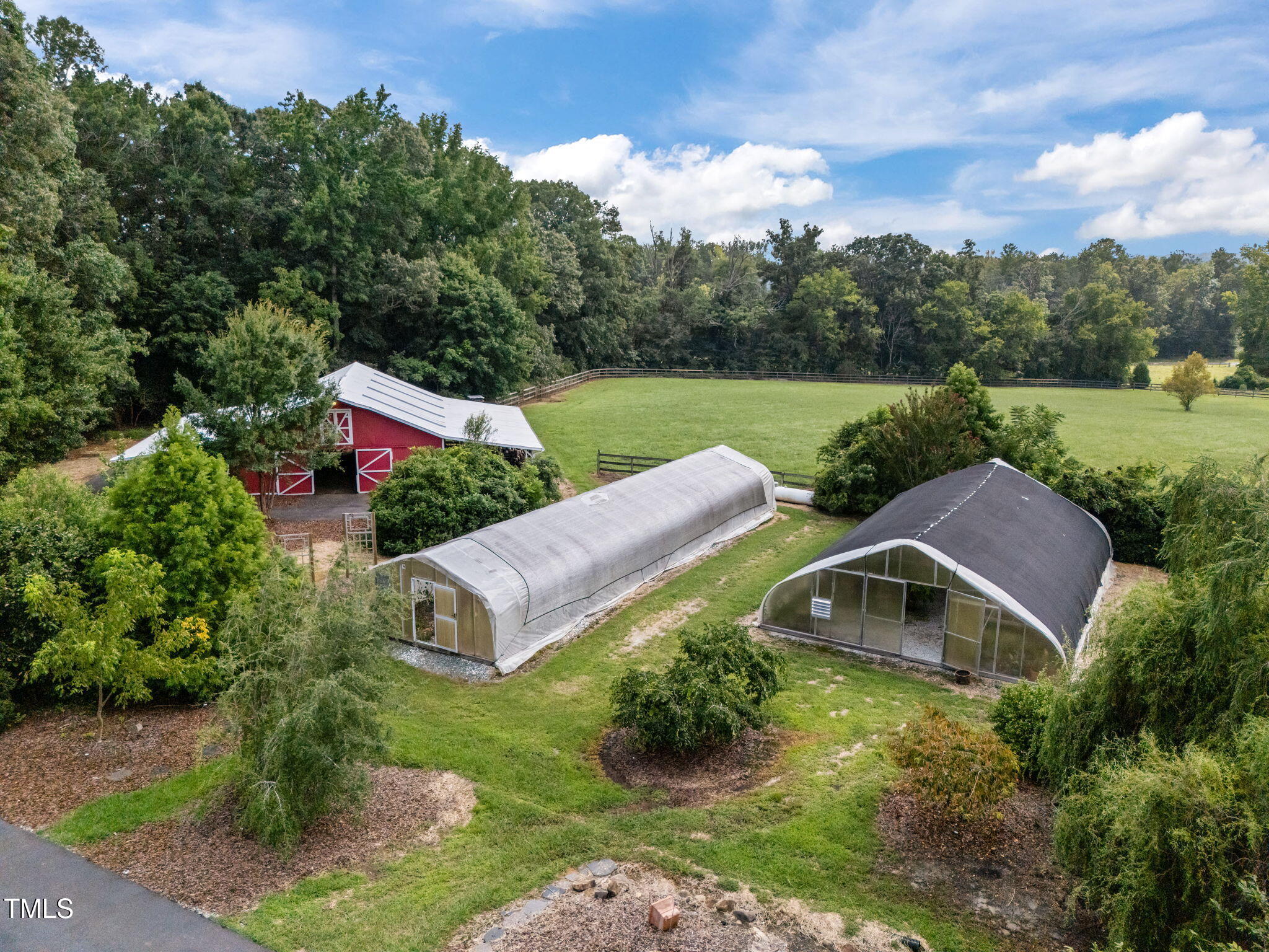 an aerial view of a house with outdoor space and street view