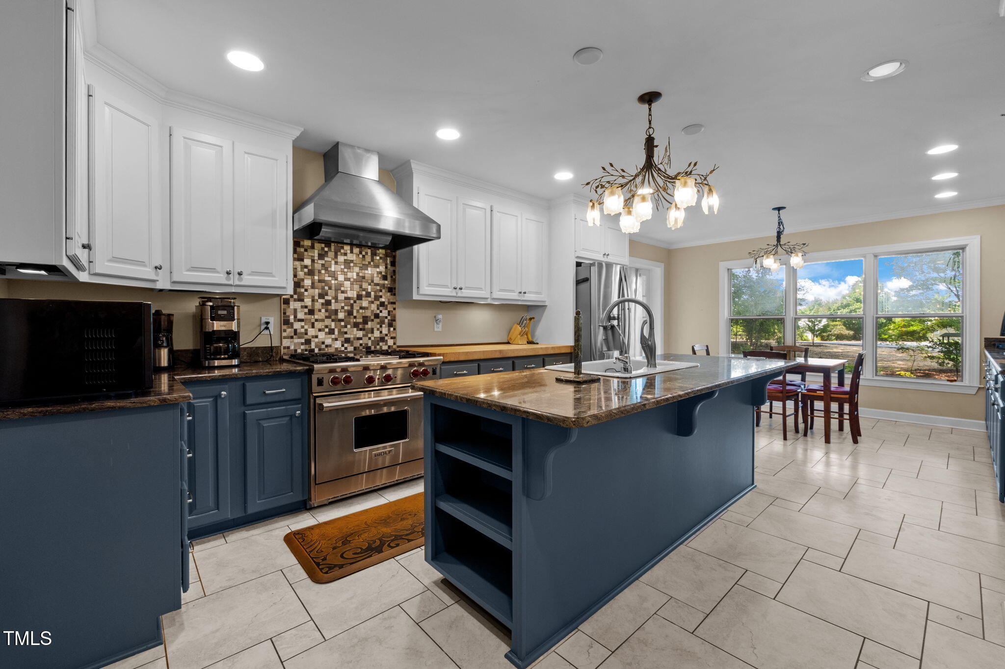 4811 New Sharon Church Road Hillsborough, NC 27278 - Photo 26 of 84 a kitchen with kitchen island granite countertop a stove oven and a sink