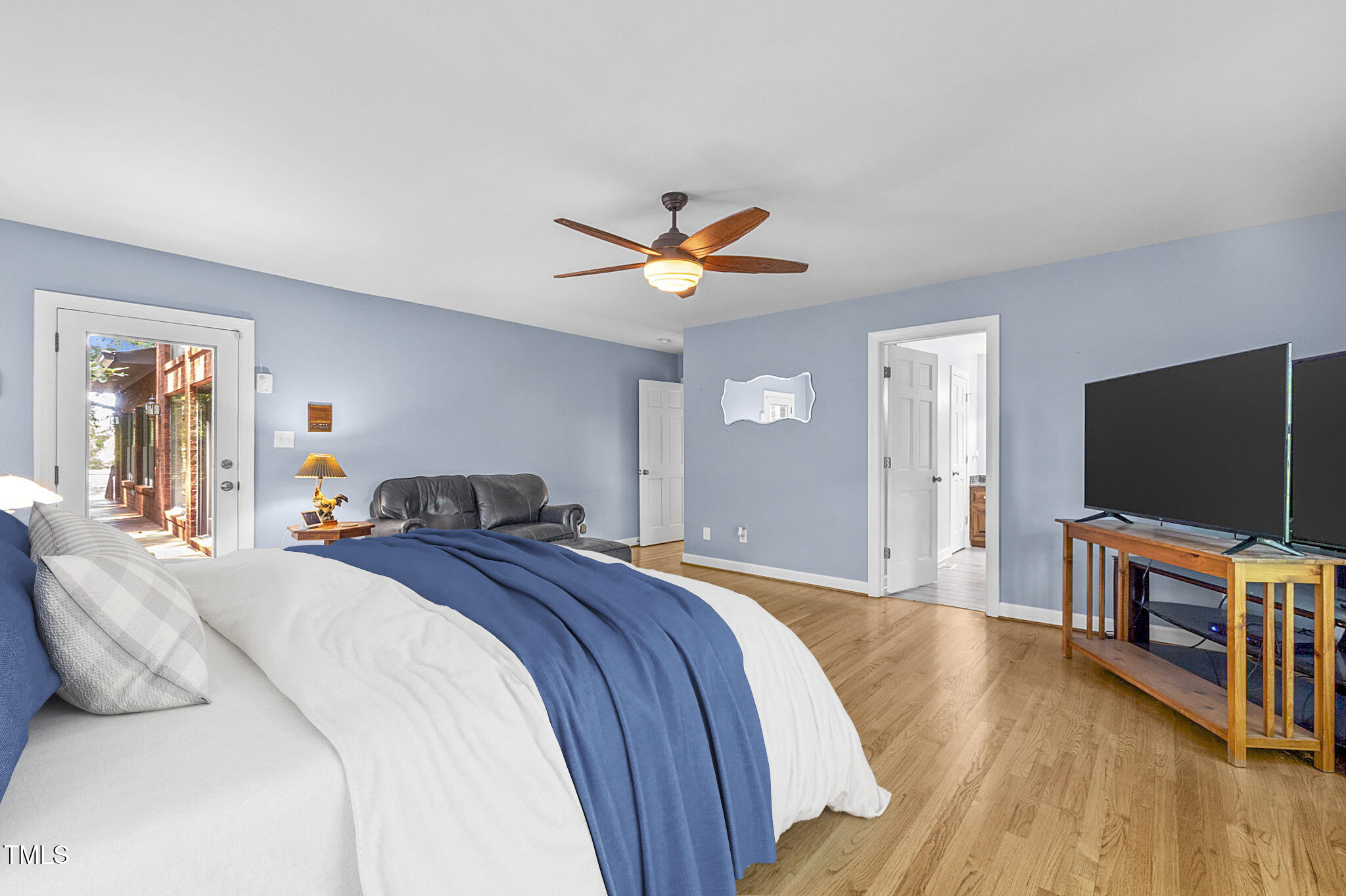 4811 New Sharon Church Road Hillsborough, NC 27278 - Photo 36 of 84 a bedroom with a bed and a flat screen tv