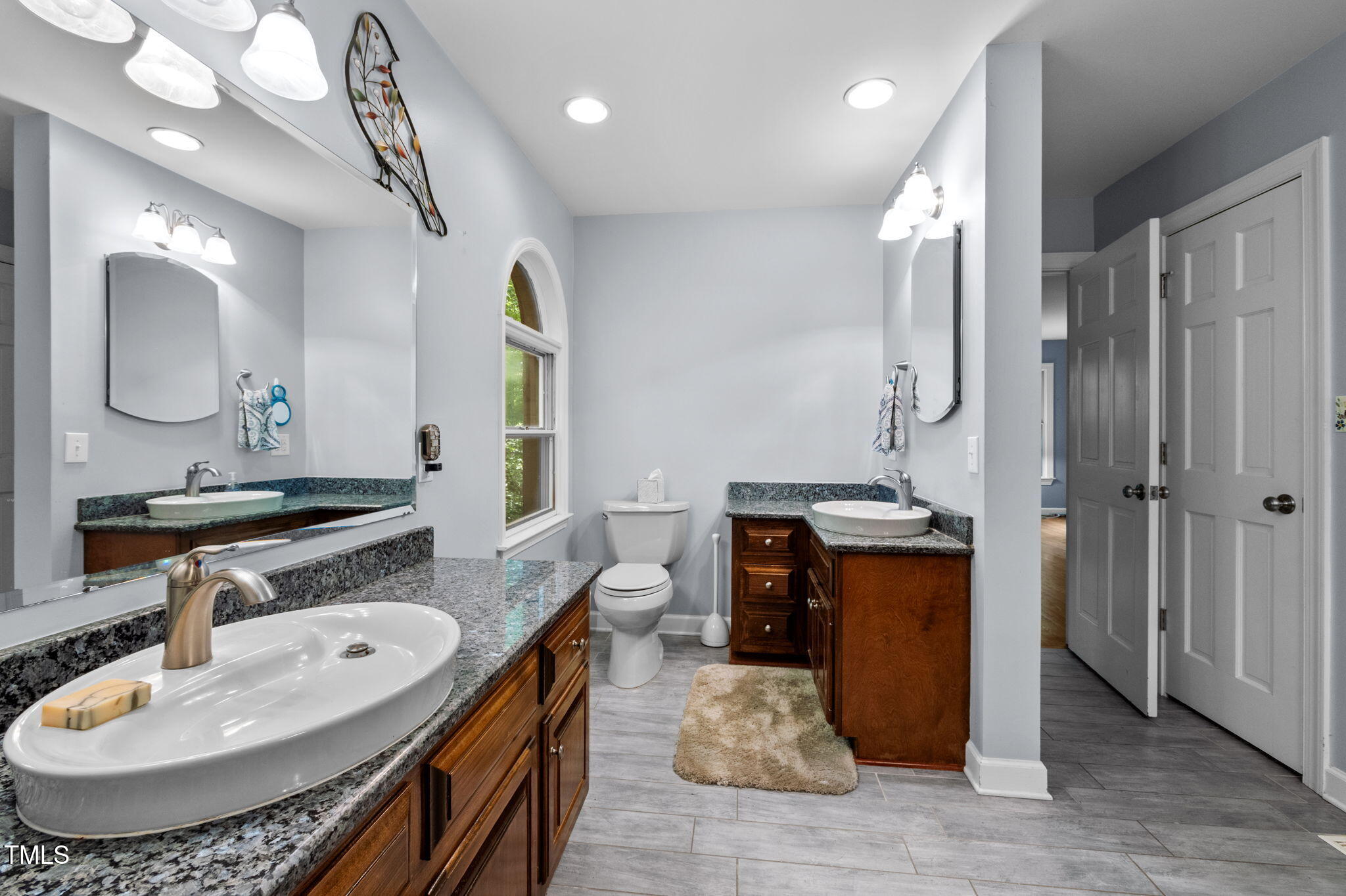 4811 New Sharon Church Road Hillsborough, NC 27278 - Photo 38 of 84 a bathroom with a sink double vanity granite and a mirror
