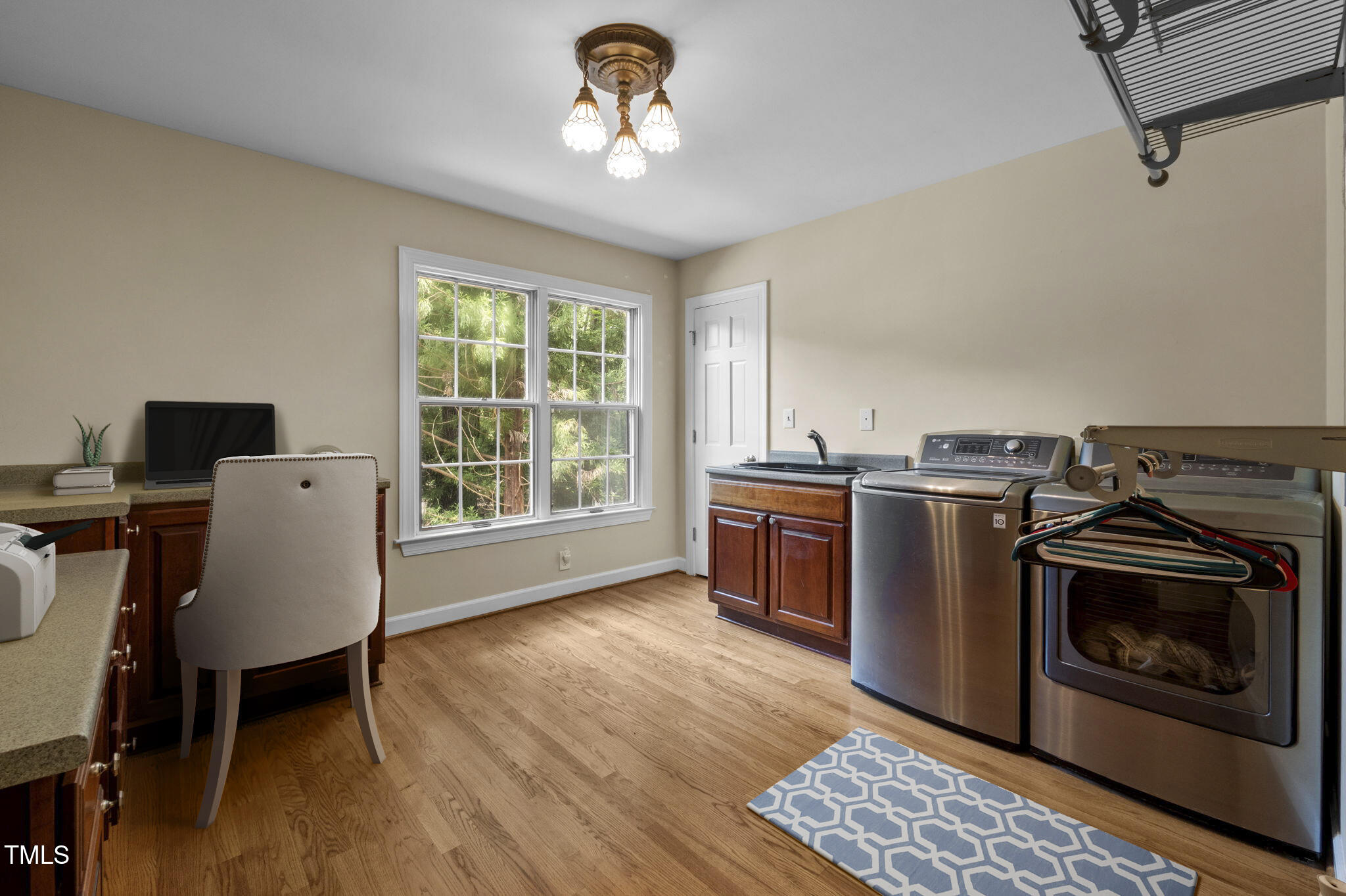 4811 New Sharon Church Road Hillsborough, NC 27278 - Photo 40 of 84 a kitchen with stainless steel appliances granite countertop a stove a sink dishwasher and a microwave with wooden floor