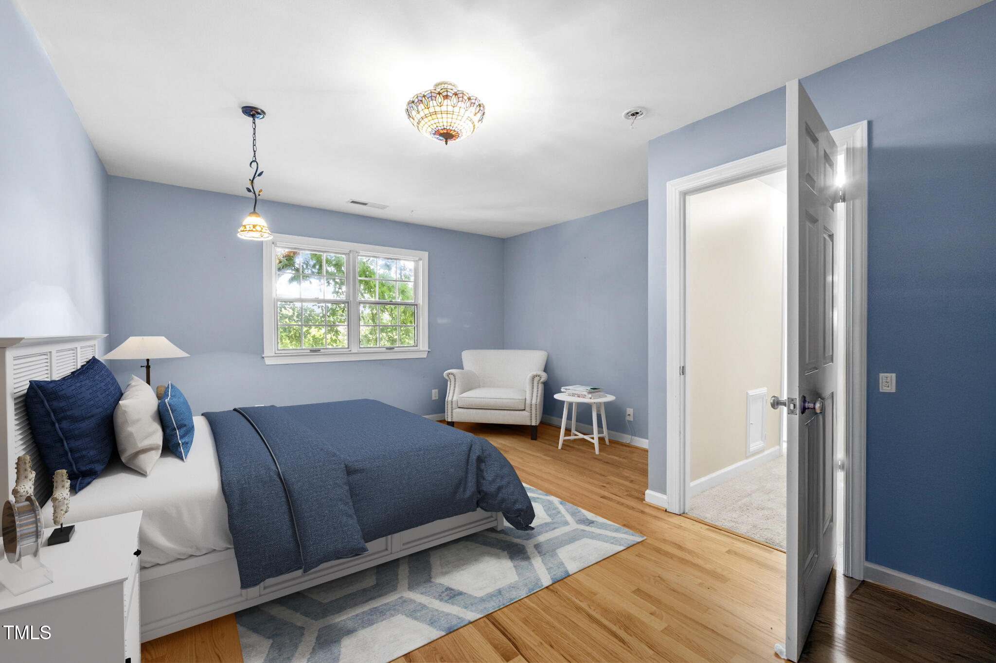 4811 New Sharon Church Road Hillsborough, NC 27278 - Photo 49 of 84 a bedroom with a bed and wooden floor