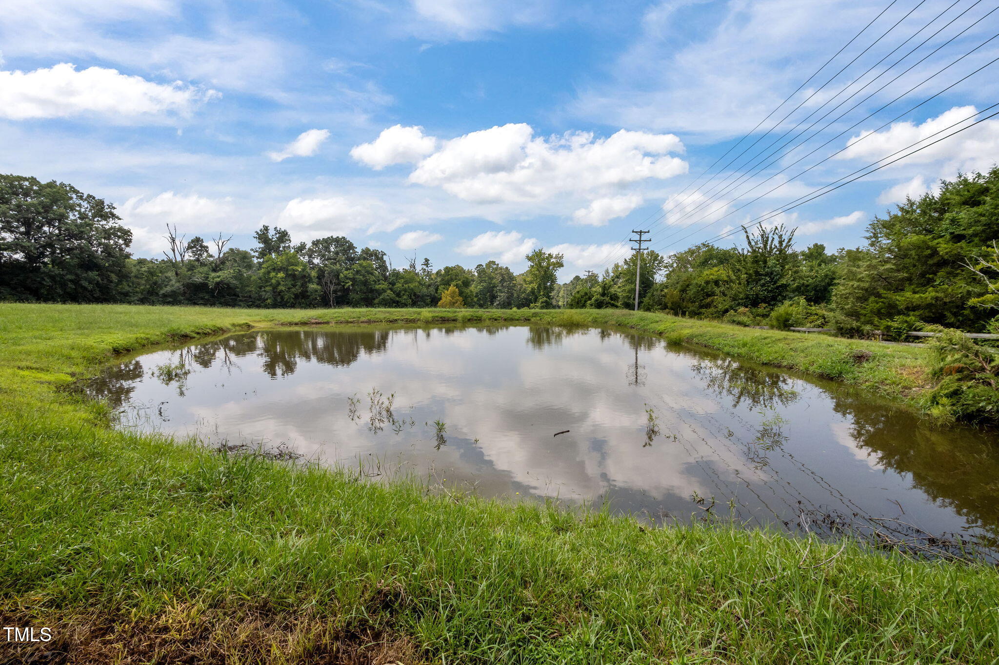 4811 New Sharon Church Road Hillsborough, NC 27278 - Photo 6 of 84 a view of a lake with houses in the back