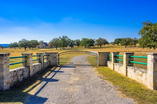 a view of a balcony with wooden floor and fence