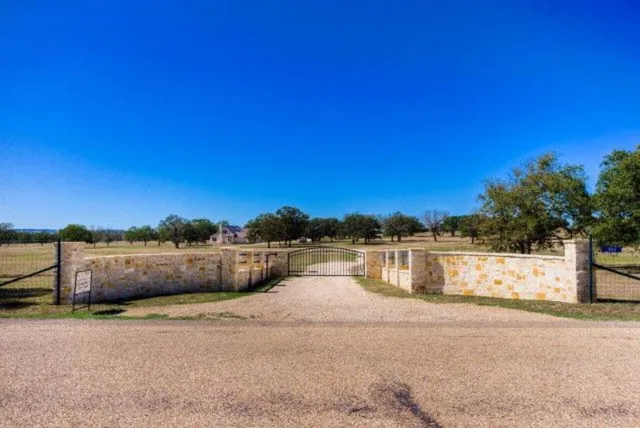 a view of swimming pool with lake and mountain in the back