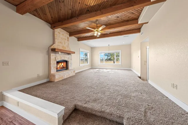 a view of livingroom with fireplace and window