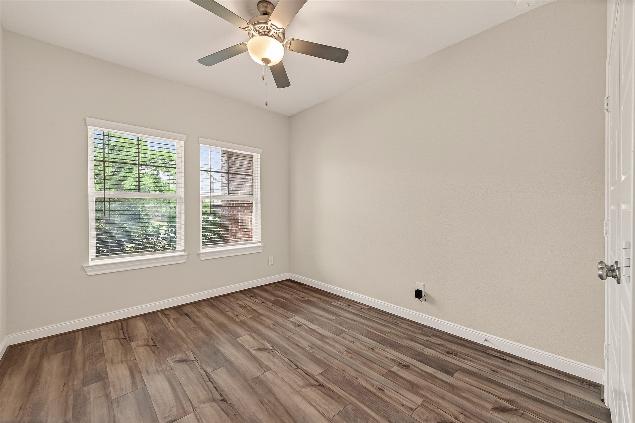 4231 Reese Ravine Lane Katy, TX 77493 - Photo 16 of 32 First floor secondary bedroom with a view of the front yard